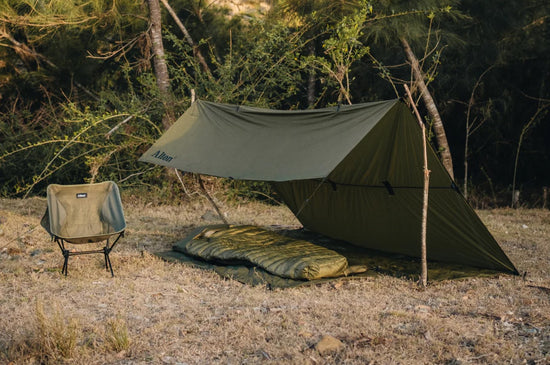 Hiking Tarp set up using ridgeline between two sticks